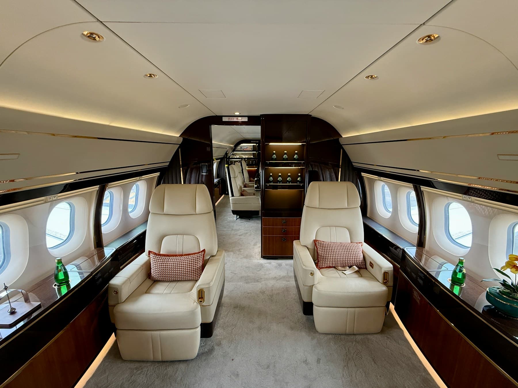 Cream leather seats in the cabin of a private jet